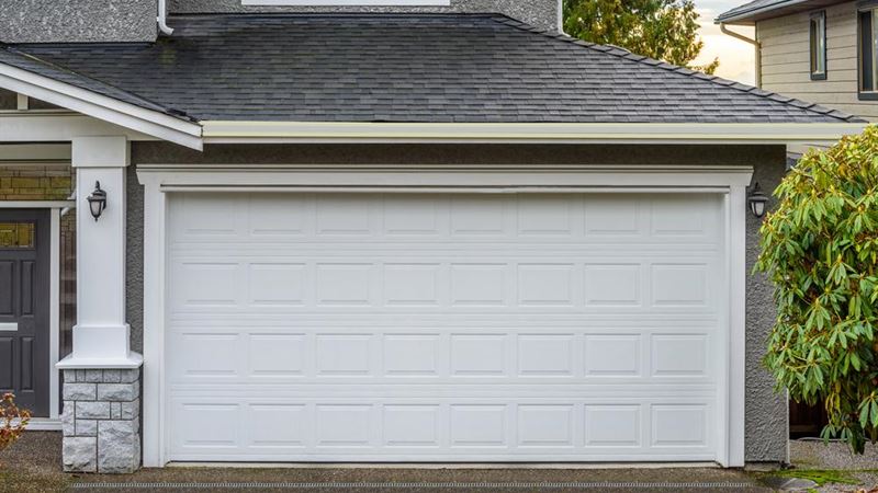 Selecting the Perfect Garage Doors: Vinyl and Wooden Options for Modern Homes